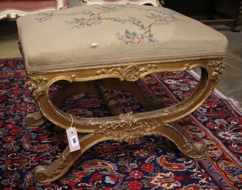 A 19th century giltwood X frame dressing stool, width 62cm, depth 41cm, height 46cm